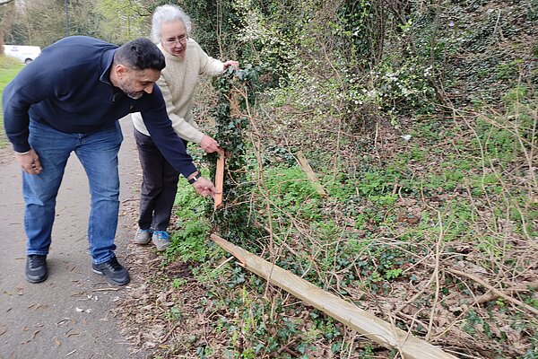 Lucy Care and Ajit Atwal viewing the broken A38 fence