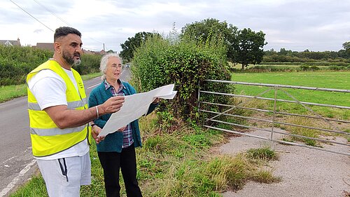 Ajit Atwal and Lucy Care looking at plans to build on the land off Moorway Lane