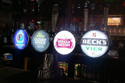 Beer Pumps on bar in pub