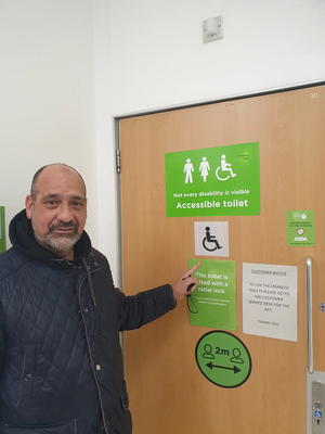 Cllr Joe Naitta With A New Disabled Toilet Sign